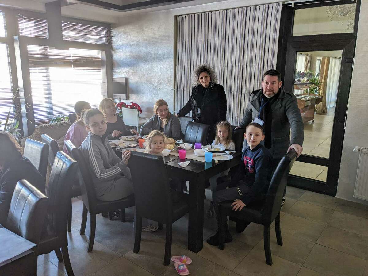 Lentner and an NGO helping a family in Siret, Romania.