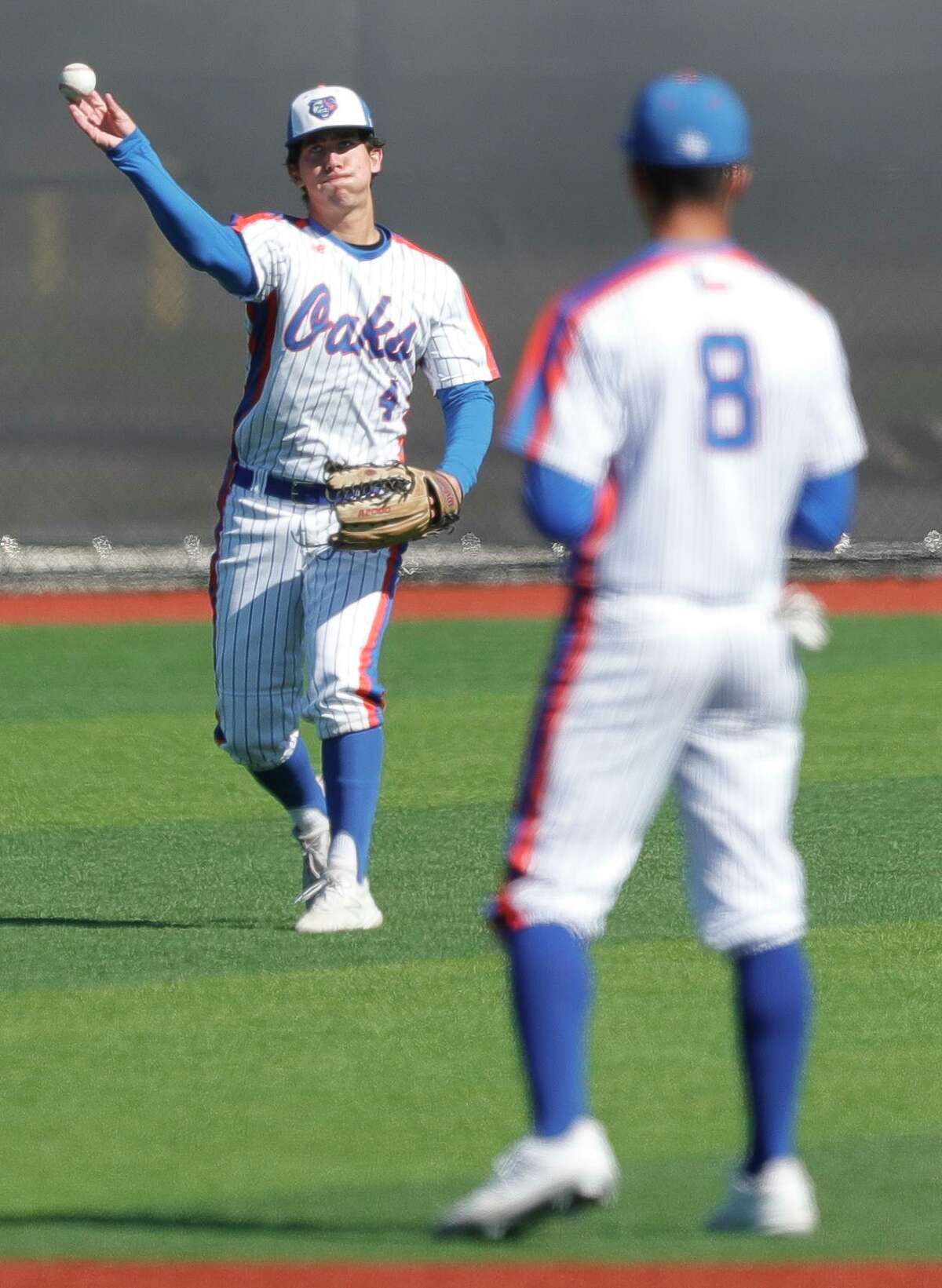 Grand Oaks center fielder Landon Meade (4) fields a single in the first inning of a high school baseball game at Grand Oaks High School, Saturday, March 12, 2022, in Spring.
