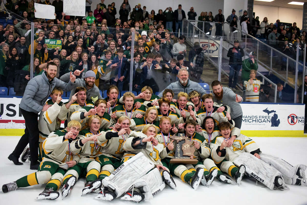 Dow players pose for a photo after their 2-0 state finals victory over St. Mary's Saturday, March 12, 2022 at USA Hockey Arena in Plymouth.