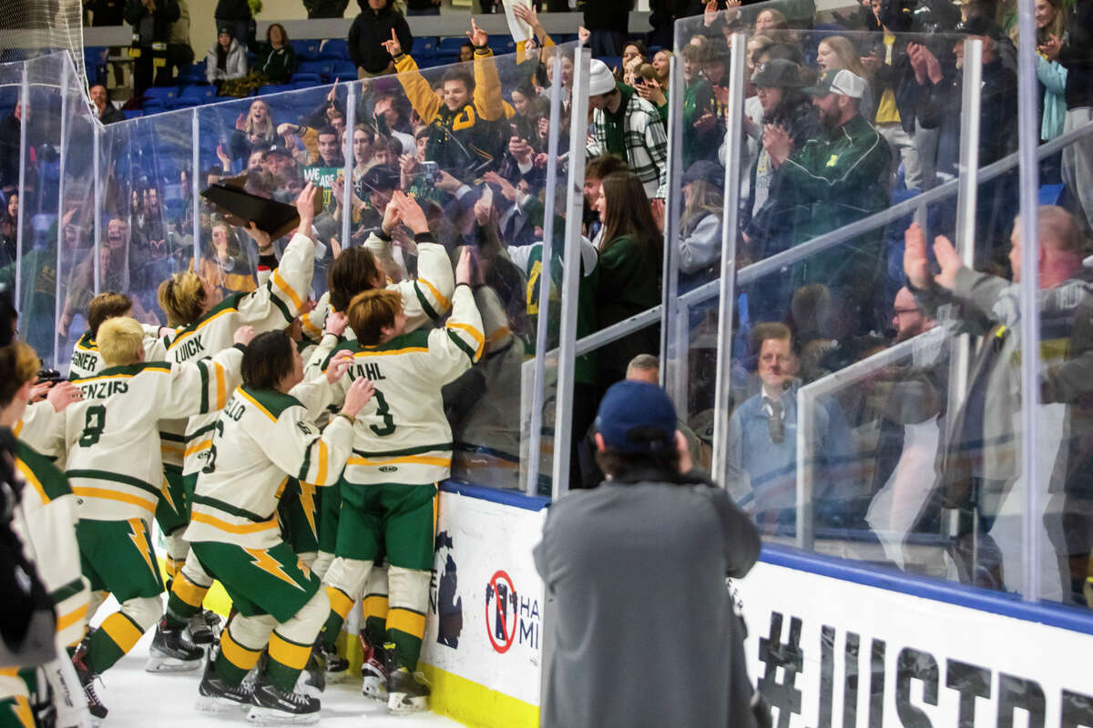 Dow players react after their 2-0 state finals victory over St. Mary's Saturday, March 12, 2022 at USA Hockey Arena in Plymouth.