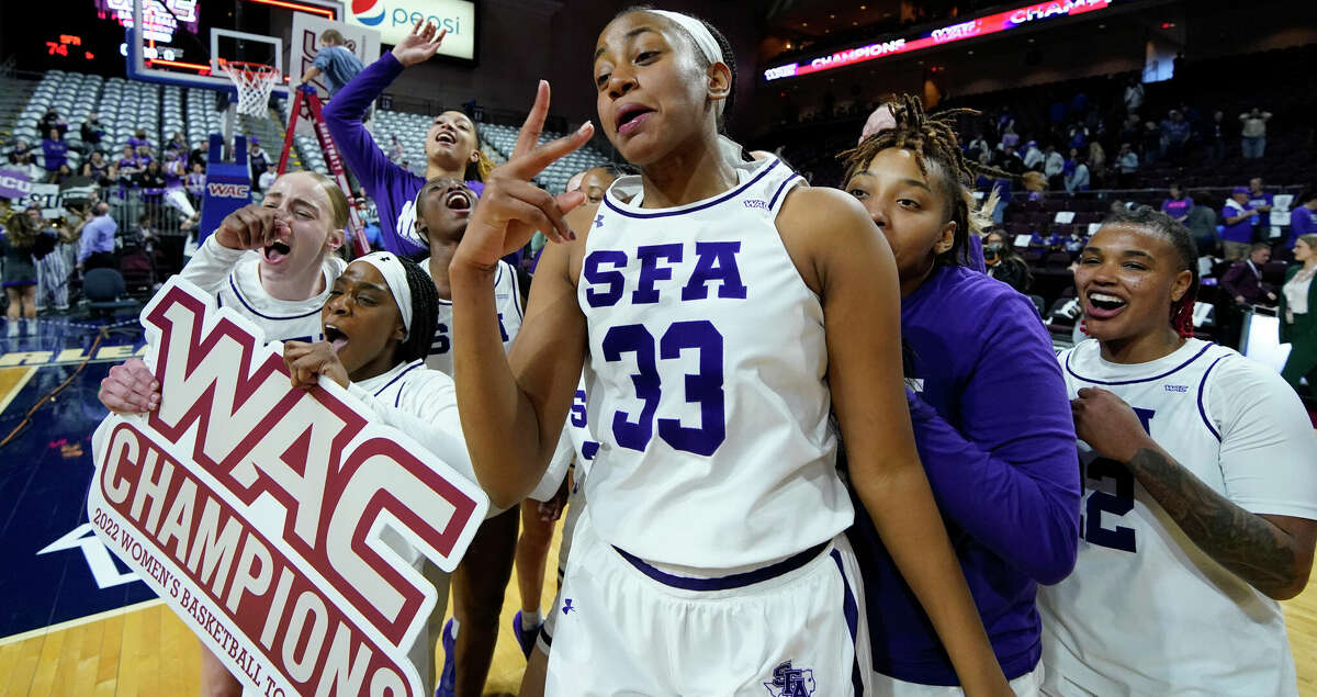 Stephen F. Austin's Aaliyah Johnson (33) celebrates with teammates after defeating Grand Canyon during in an NCAA college basketball game for the championship of the Western Athletic Conference women's tournament Saturday, March 12, 2022, in Las Vegas. (AP Photo/John Locher)