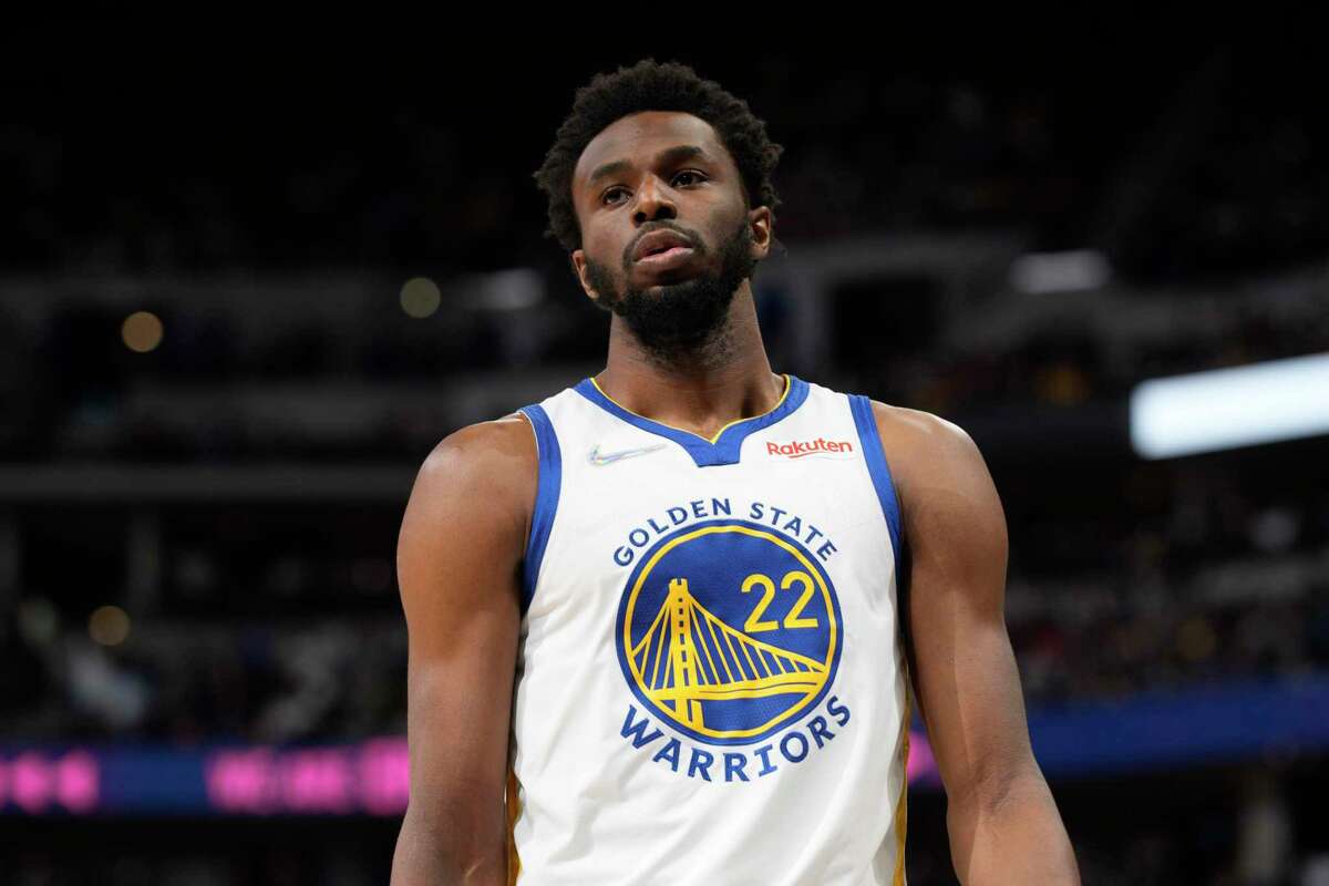 Golden State Warriors forward Andrew Wiggins (22) in the first half of an NBA basketball game Thursday, March 10, 2022, in Denver. (AP Photo/David Zalubowski)