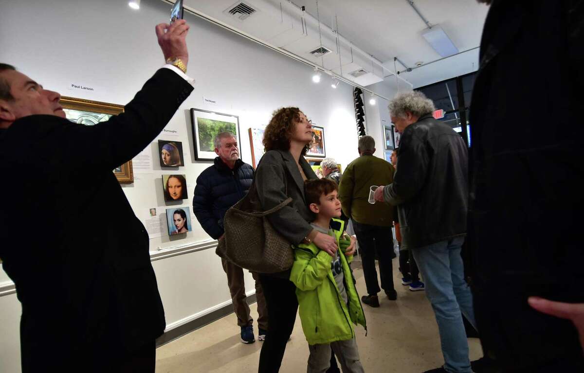The Norwalk artist and gallery owner Oksana Tanasiv hosted at art show featuring the work of several Ukrainian American artists at Oksana Tanasiv gallery in Norwalk, Conn., on Saturday March 12, 2022. All of the sales proceeds going to help victims of the war in Ukraine.