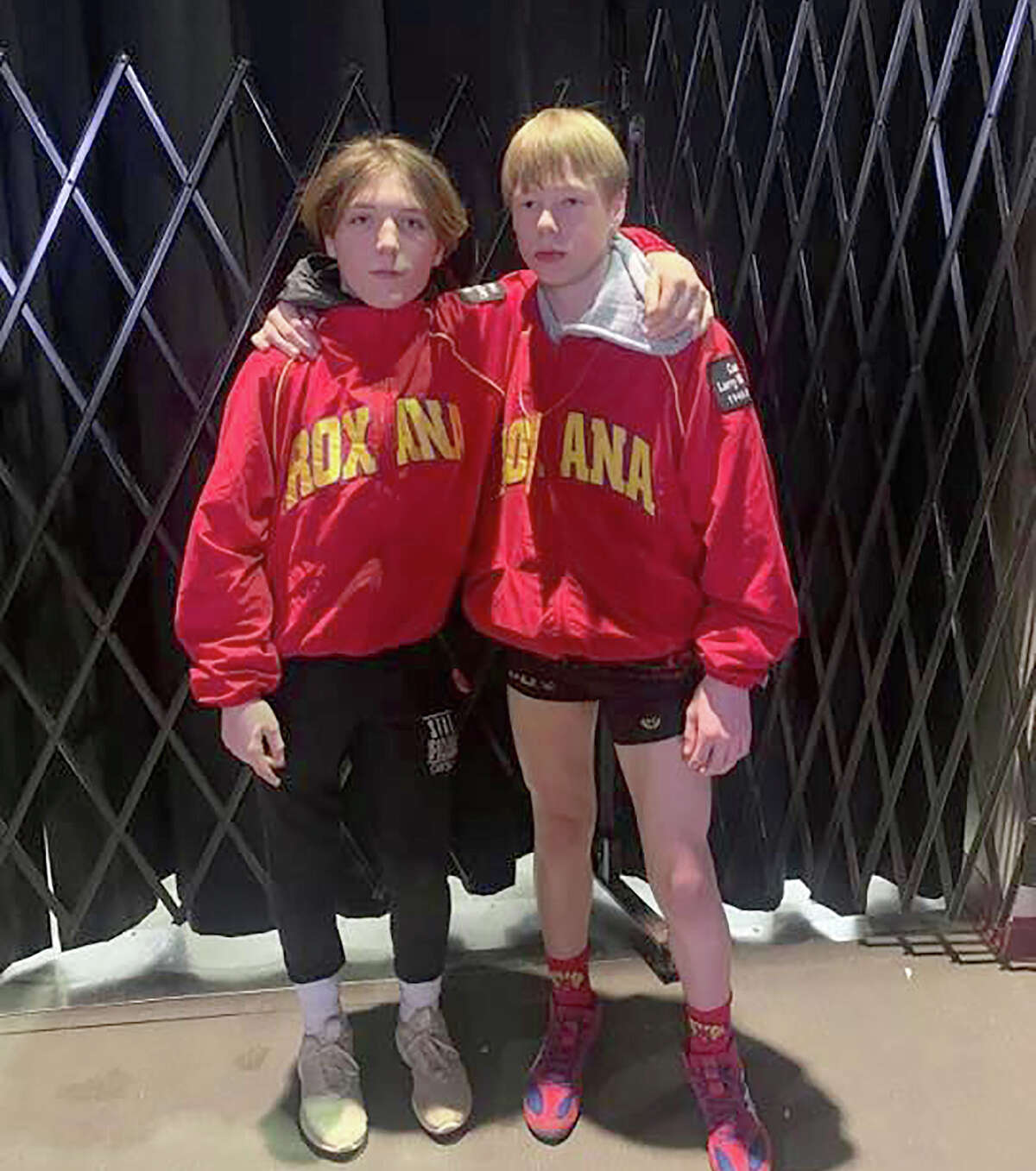 Roxana state finalists Brandon Green, left, and teammate Lyndon Thies pause at the IESA State Wrestling Championships Saturday at Northern Illinois University in DeKalb. Green captured the Class A state championship at 119 pounds and Thies was second at 126 pounds.