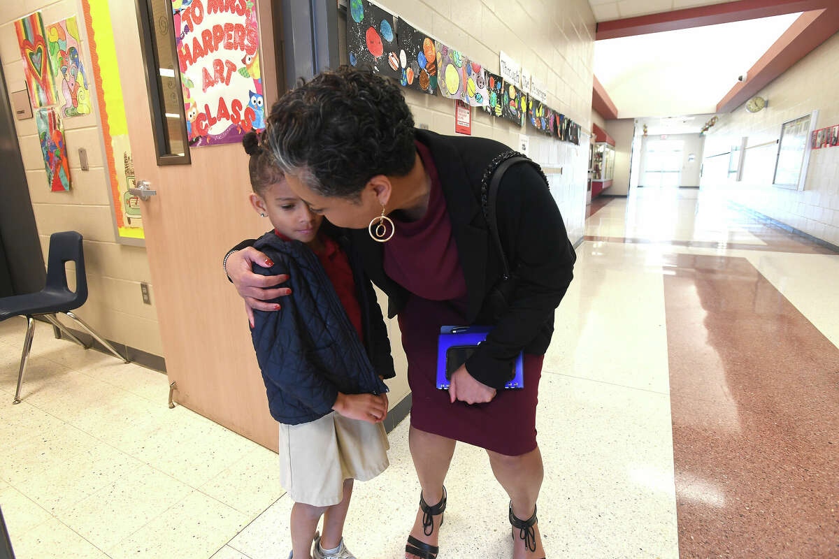 BISD Assistant Superindent Dr. Anita Frank made a school visit to Dishman Elementary, stopping to talk with students, including kindergartner Cori Collins. Photo made Thursday, March 10, 2022 Kim Brent/The Enterprise