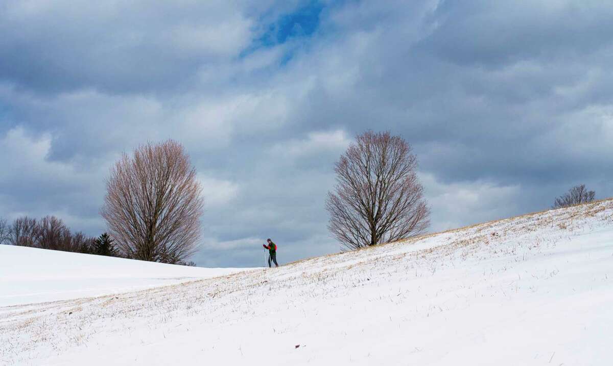 A cross country skier glides across the snow at Capital Hills at Albany golf course on Sunday, March 13, 2022, in Albany, N.Y. Higher elevations are predicted to get snow April 3, 2022.