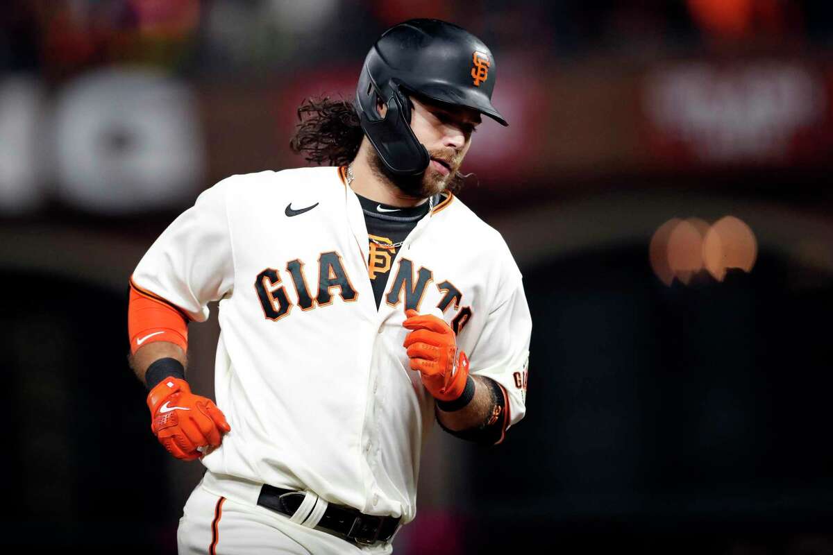 San Francisco Giants' Brandon Crawford rounds the bases after his solo home run in 8th inning against Los Angeles Dodgers during National League Division Series Game 1 at Oracle Park in San Francisco, Calif., on Friday, October 8, 2021