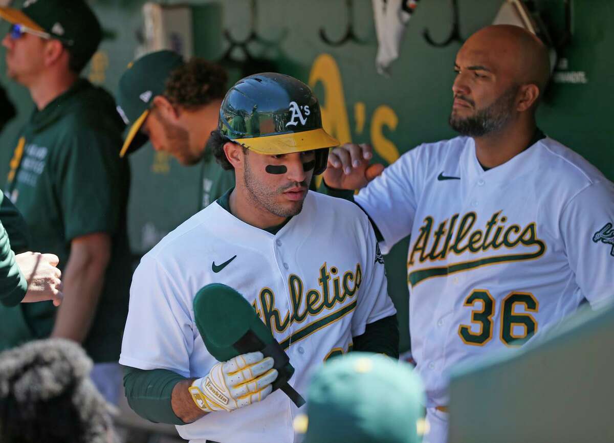 Ramón Laureano rejoins A's in camp, still under suspension but healthy  after surgery