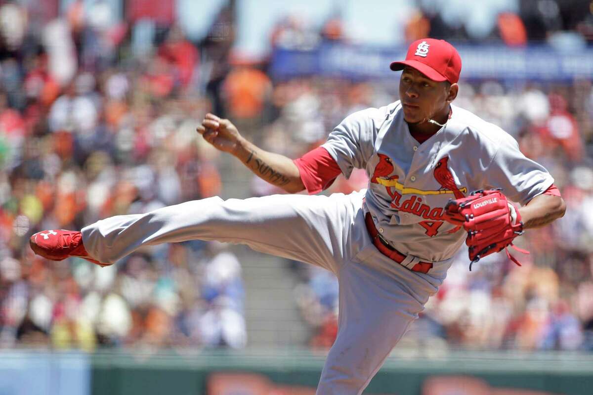 St. Louis Cardinals starting pitcher Carlos Martinez throws in the first inning of their baseball game against the San Francisco Giants Thursday, July 3, 2014, in San Francisco. (AP Photo/Eric Risberg)