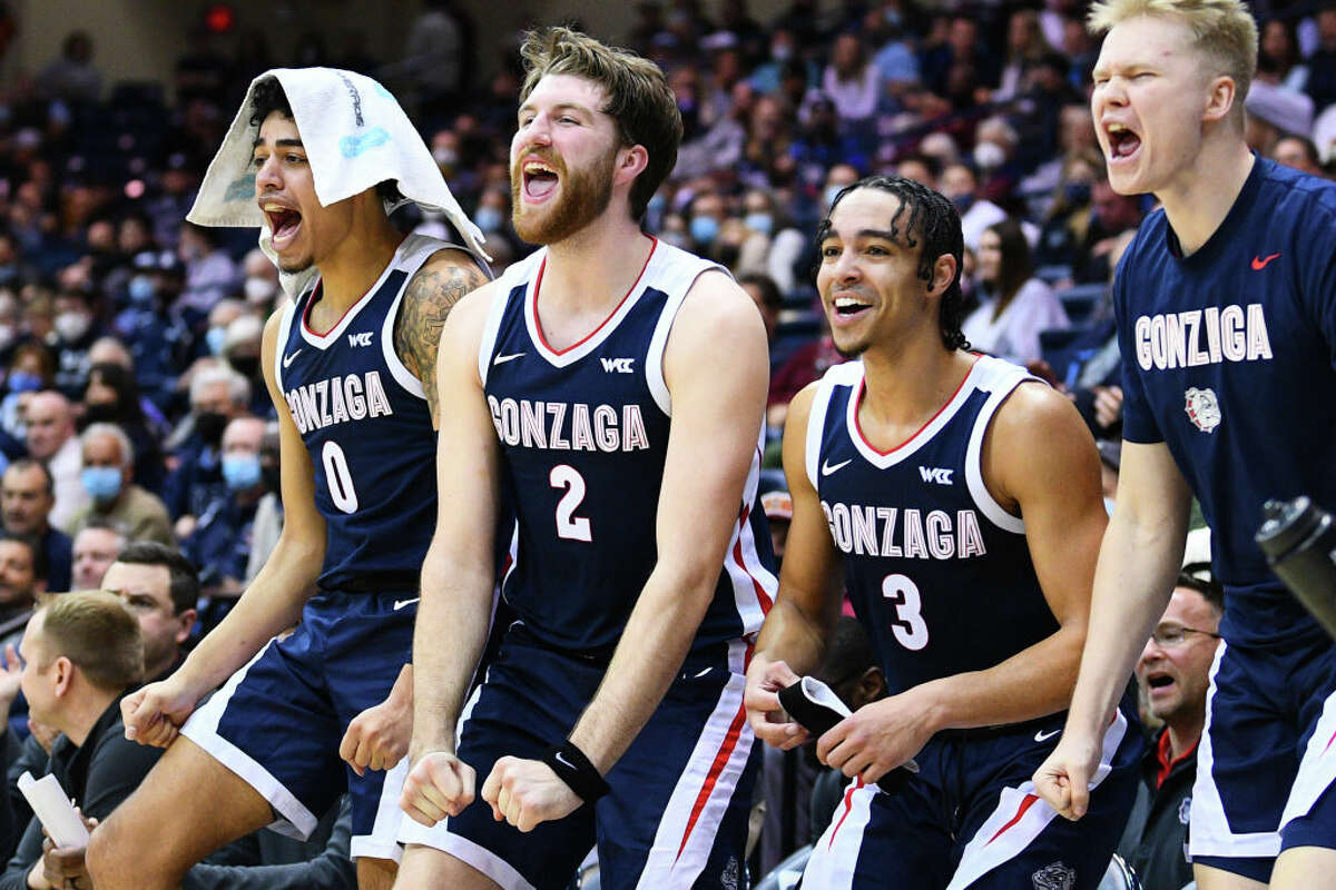 Gonzaga guard Julian Strawther (0), Gonzaga forward Drew Timme (2) and Gonzaga guard Andrew Nembhard (3) celebrate on the bench during the college basketball game between the Gonzaga Bulldogs and the USD Toreros on February 3, 2022 at the Jenny Craig Pavilion in San Diego, CA. (Photo by Brian Rothmuller/Icon Sportswire via Getty Images)