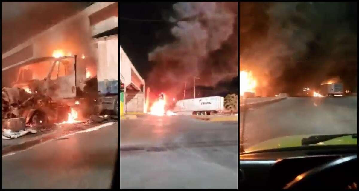 Screenshots from a video posted on social media show numerous trucks on fire in Nuevo Laredo on Monday, March 14, 2022 after reports of gunfire and explosions in the city in the early morning hours of that day.