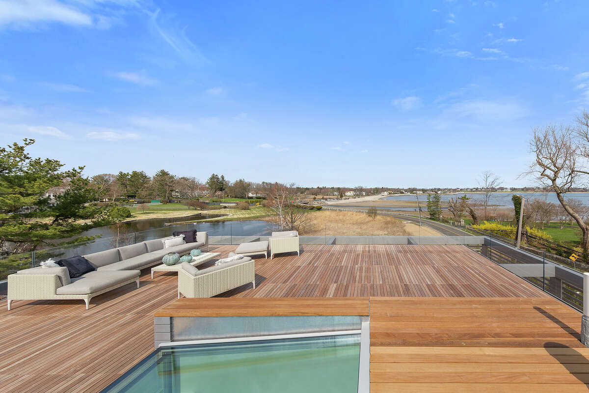 The home on 131 Beachside Avenue in Westport, Conn. has a rooftop deck accessible through a retractable glass ceiling. 