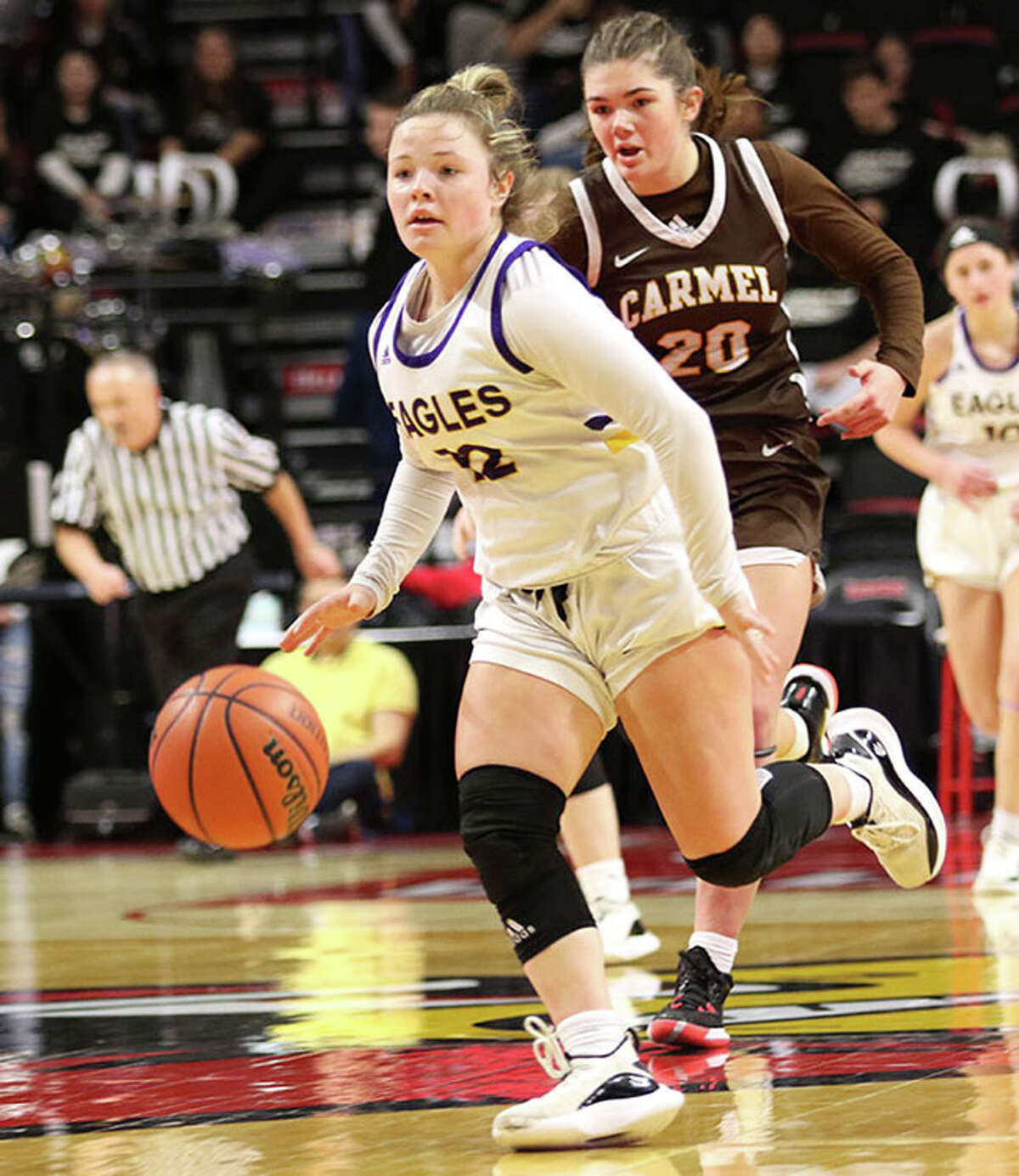 CM junior point guard Aubree Wallace heads upcourt ahead of Mundelein Carmel's Mia Gillis (20) in a Class 3A state tournament semifinal March 4 at Redbird Arena in Normal.