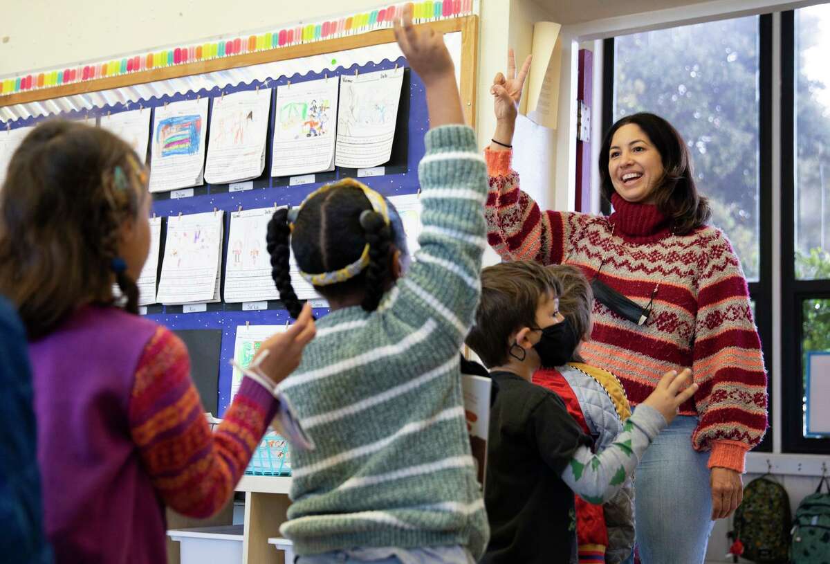 Kindergarten teacher Jacqueline Murillo goes mask-free at Ruth Acty Elementary in Berkeley. The decision to make masks optional came as cases, hospitalizations and deaths from COVID-19 continued to plummet.