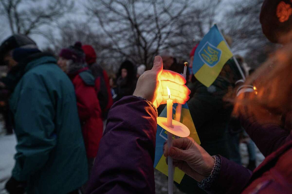 Ridgefield residents gather in Ballard Park for a candlelight vigil to stand in solidarity with Ukraine amid the ongoing invasion from Russia. Sunday, March 13, 2022, Ridgefield, Conn.