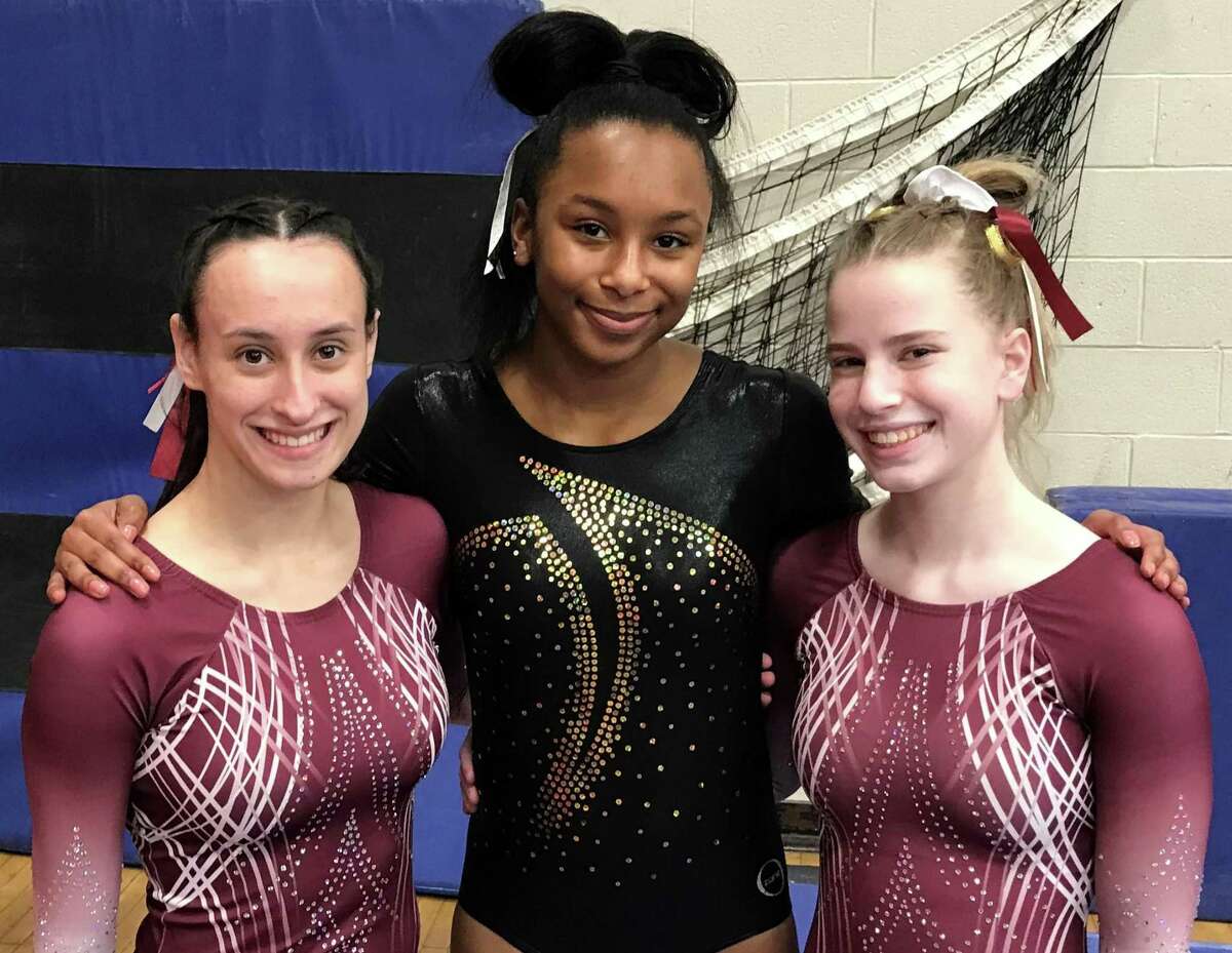 St. Joseph’s Julianna Rizzitelli, Trumbull’s Ariana Seabourne, and St. Joseph’s Lindsay Capobianco competed at the New England Girls Gymnastics Championship.