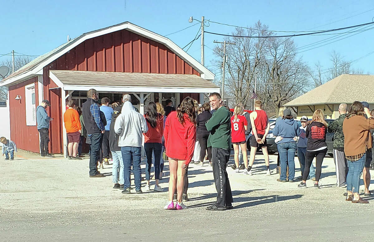 A line forms this weekend outside of Heavenly Delight ice cream shop at 101 E. Prospect St. in Murrayville. The popular spot for cool treats opened for the season last week.