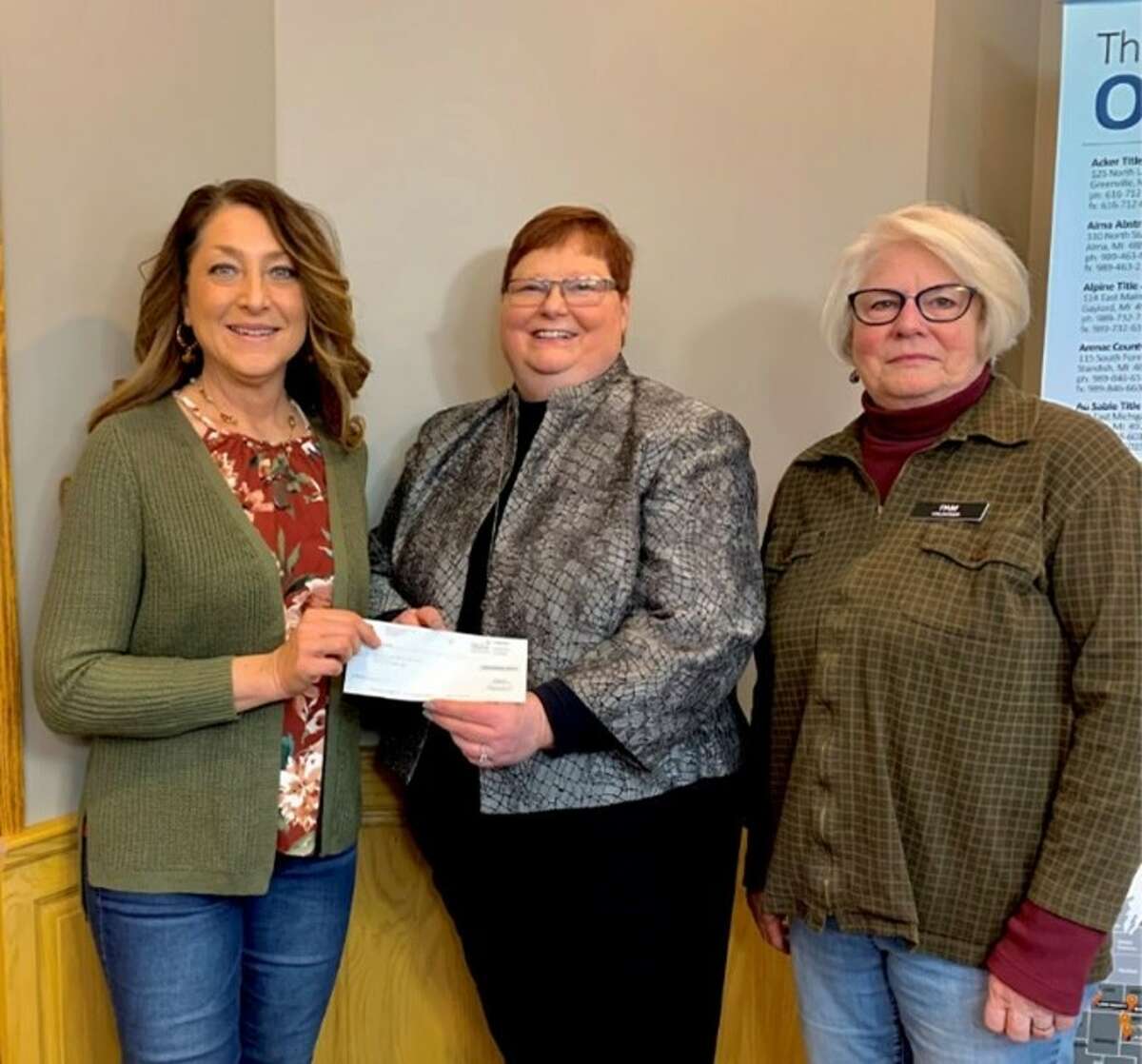 Ice Mountain natural resource manager Arlene Anderson-Vincent (left) presented a check for $2,000 to Barryton Mobile Food Pantry board members Karen McKenzie (center) and Pam Forbes (right).