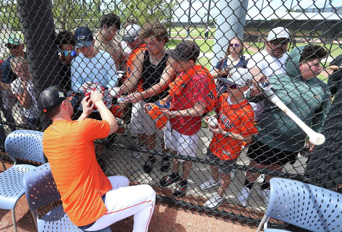 Houston Astros third baseman Alex Bregman (2) signs autographs during work outs at the Astros spring training camp at The Ballpark of the Palm Beaches on Monday, March 14, 2022 in West Palm Beach .