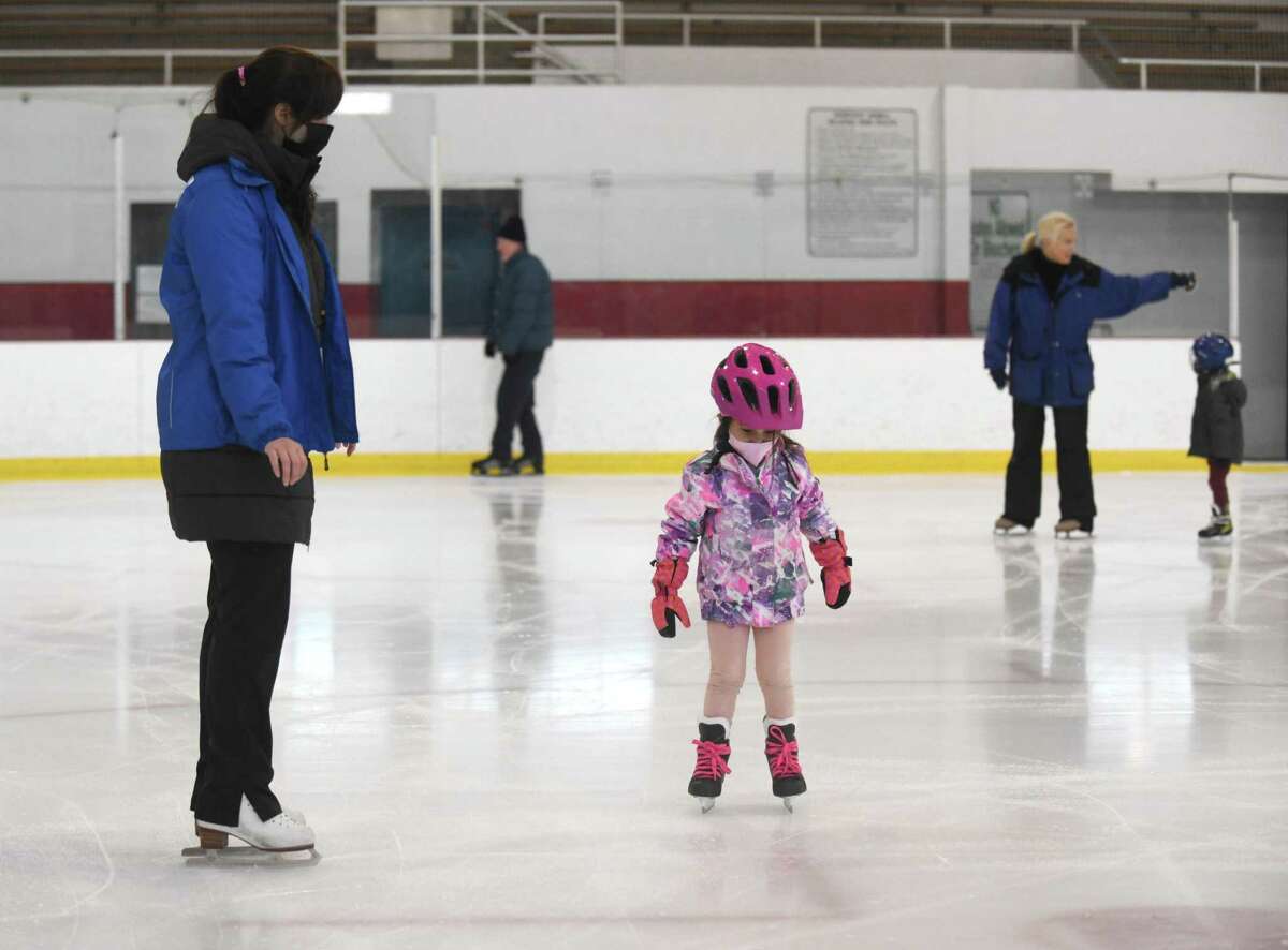 Greenwich's Millie Zachary, 3, gets a skating lesson from Stefannie Ducksworth at Dorothy Hamill Skating Rink in the Byram section of Greenwich, Conn. Thursday, March 3, 2022.
