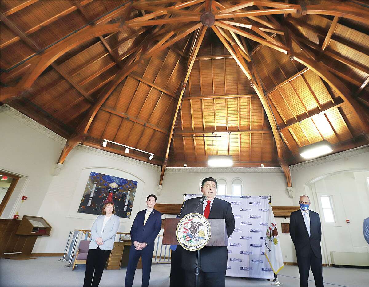 Gov. J.B. Pritzker on Monday announced state funding for renovations of the five campus buildings at Lewis & Clark Community College, including the historic Reid Memorial Library, where he made the announcement.