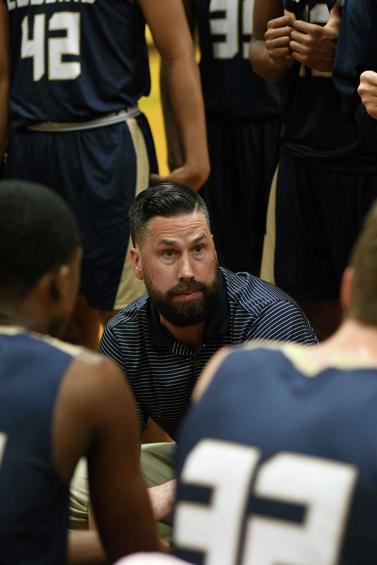 Klein Collins’ Scott Harmatuk, center, was named co-District 15-6A Coach of the Year.