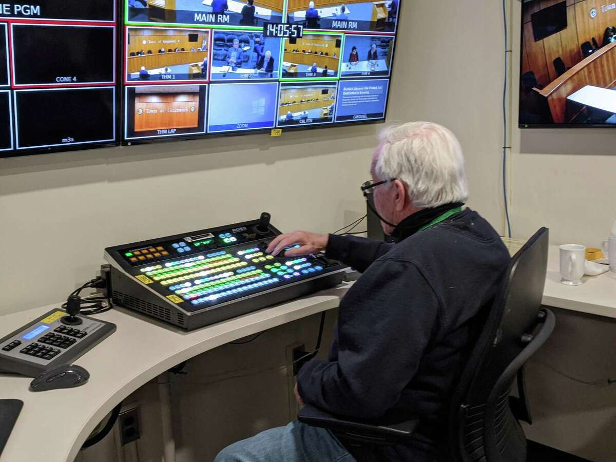 Town volunteer Don Conway monitors the control booth during a recent GCTV live broadcast of a BET Budget Committee meeting. A new consultants’ report lists several suggestions for giving GCTV a face lift, including with a new name and logo. But it is unclear how much those will cost and what it means for current operations.