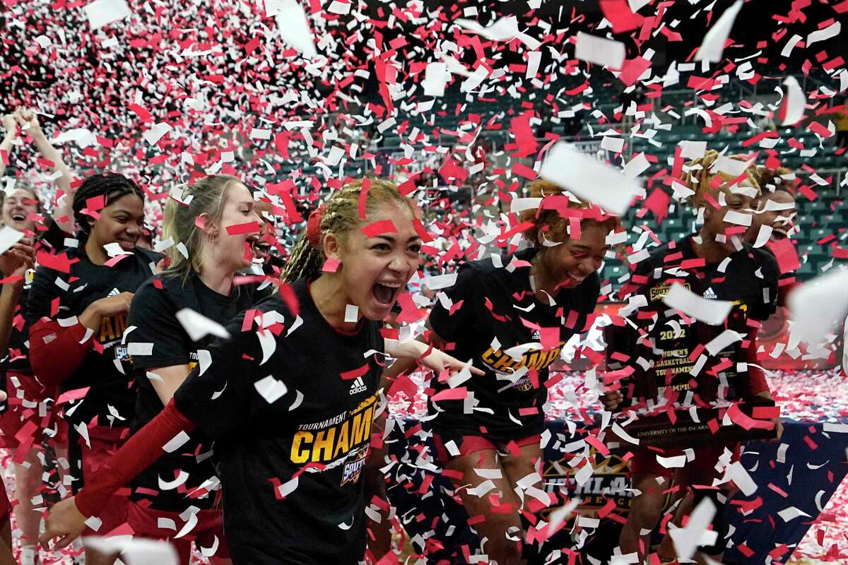 Incarnate Word’s Destiny Jenkins, center, celebrates with teammates after the Southland Conference tournament championship against Southeastern Louisiana on Sunday, March 13, 2022, in Katy. Incarnate Word won 56-52 in overtime.