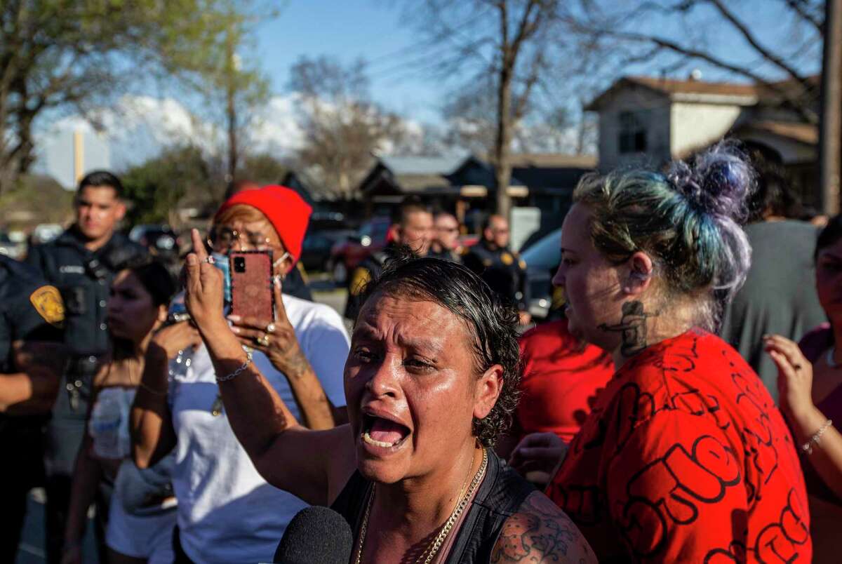 Arlene Garcia expresses her frustration on Monday near the scene of where she said her son was shot nine times by San Antonio police officers.