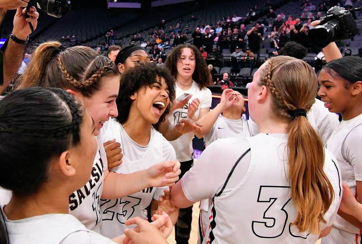 The Salesian-Richmond girls celebrate after winning the state Division I championship at Golden 1 Center in Sacramento.
