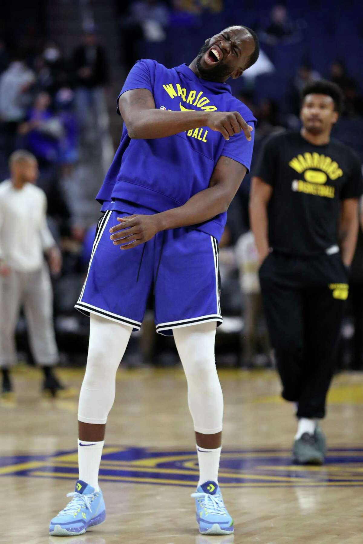 Golden State Warriors' Draymond Green reacts to missing a 3-pointer while warming up before playing Washington Wizards during NBA game at Chase Center in San Francisco, Calif., on Monday, March 14, 2022.