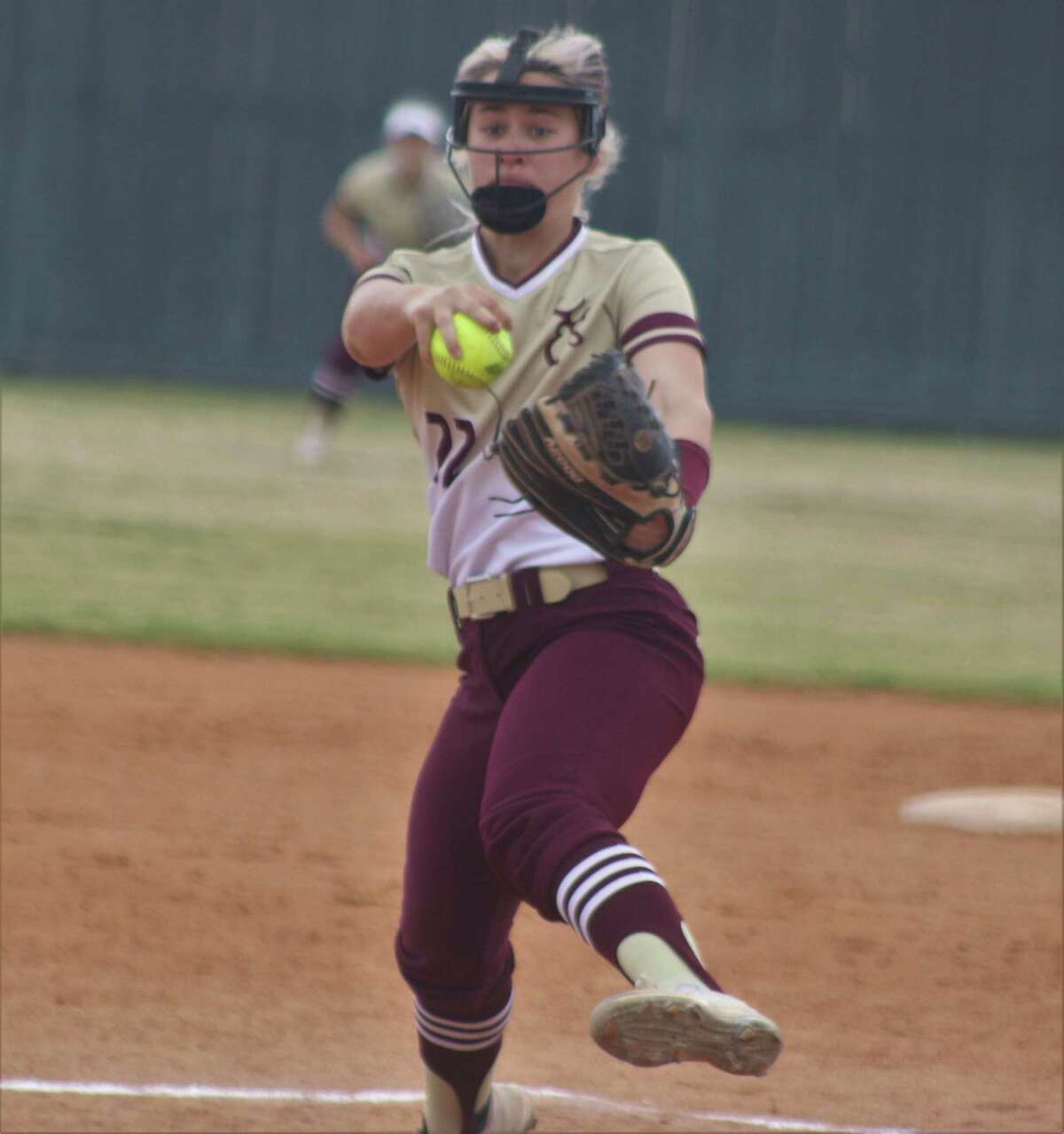 Lady Deer pitcher Reanna Nieman guns a pitch to the plate during Monday morning's meeting with Pearland Dawson. Niemann was going to get a no-decision but her teammates, down to their final out, rallied for two runs in the seventh and a winning run in the eighth.