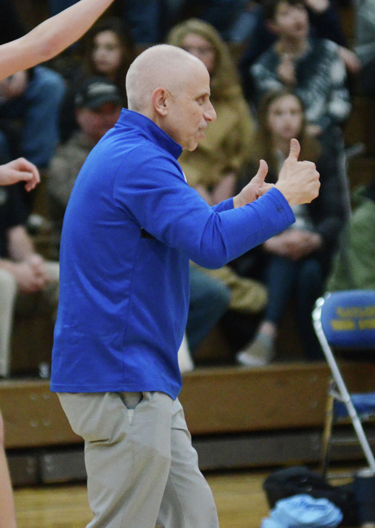 Midland High coach Eric Krause encourages his team during Monday's regional semifinal against Petoskey, March 14, 2022.