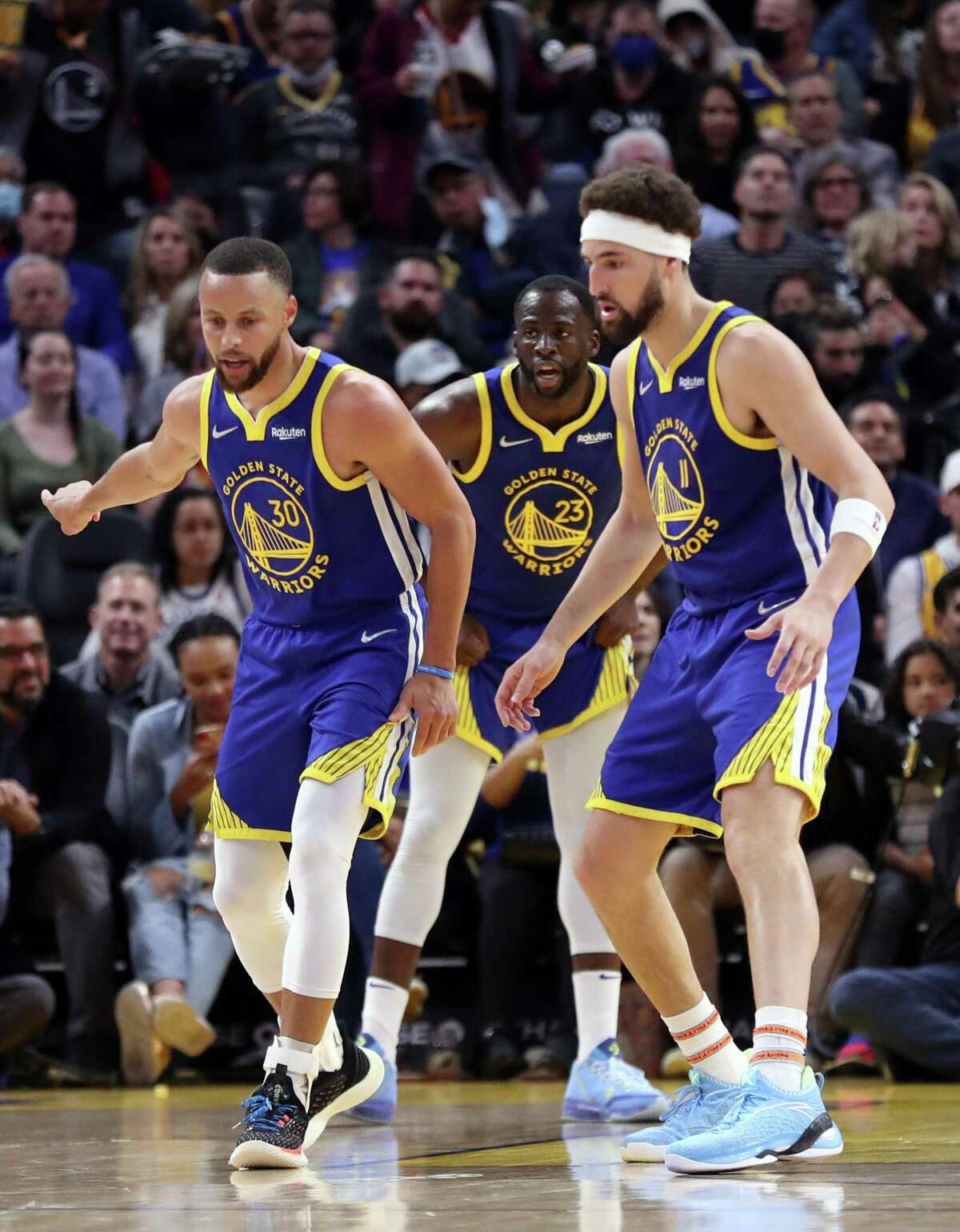 Golden State Warriors' Stephen Curry, Draymond Green and Klay Thompson play defense in 2nd quarter against Washington Wizards during NBA game at Chase Center in San Francisco, Calif., on Monday, March 14, 2022.