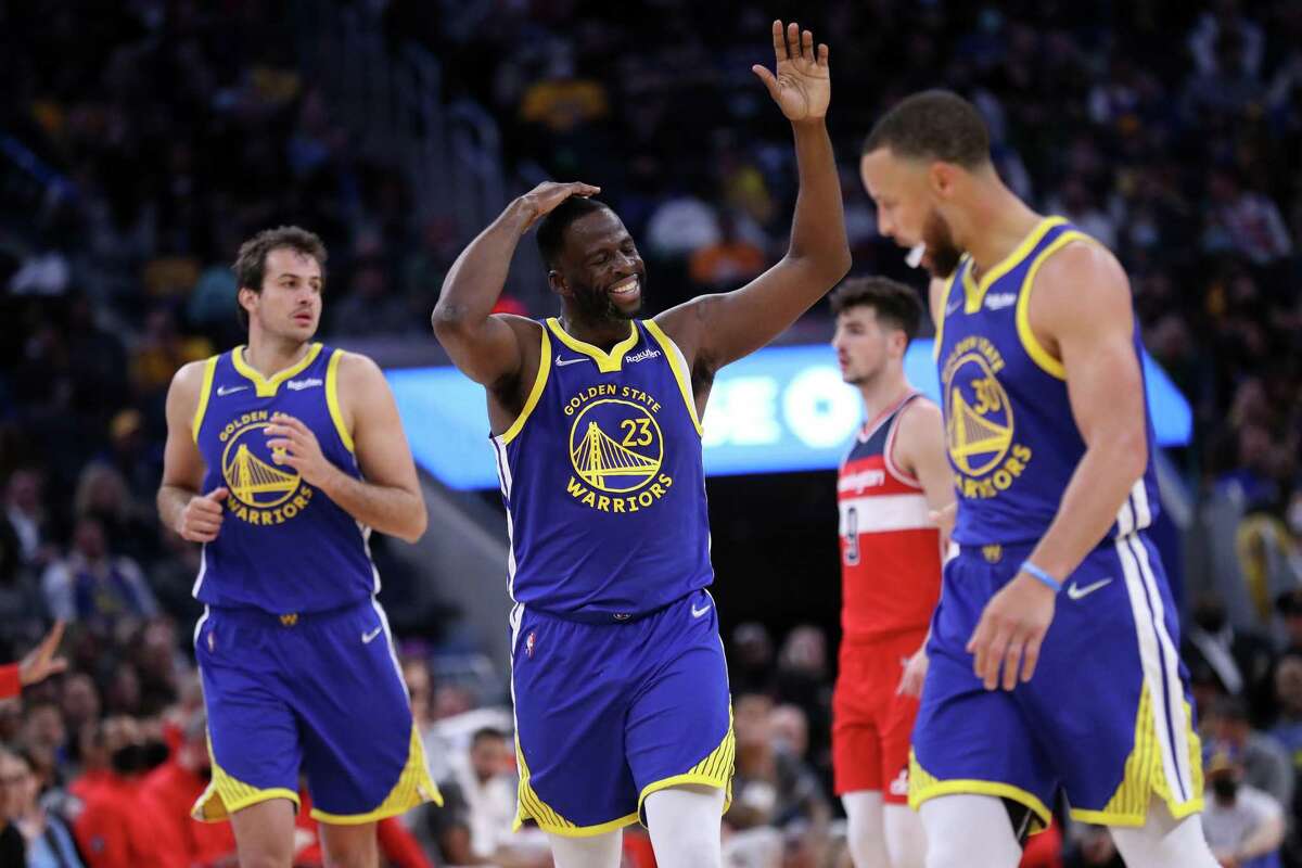 Golden State Warriors' Draymond Green takes responsibility for a turnover during Warriors' 126-112 win over Washington Wizards in NBA game at Chase Center in San Francisco, Calif., on Monday, March 14, 2022.