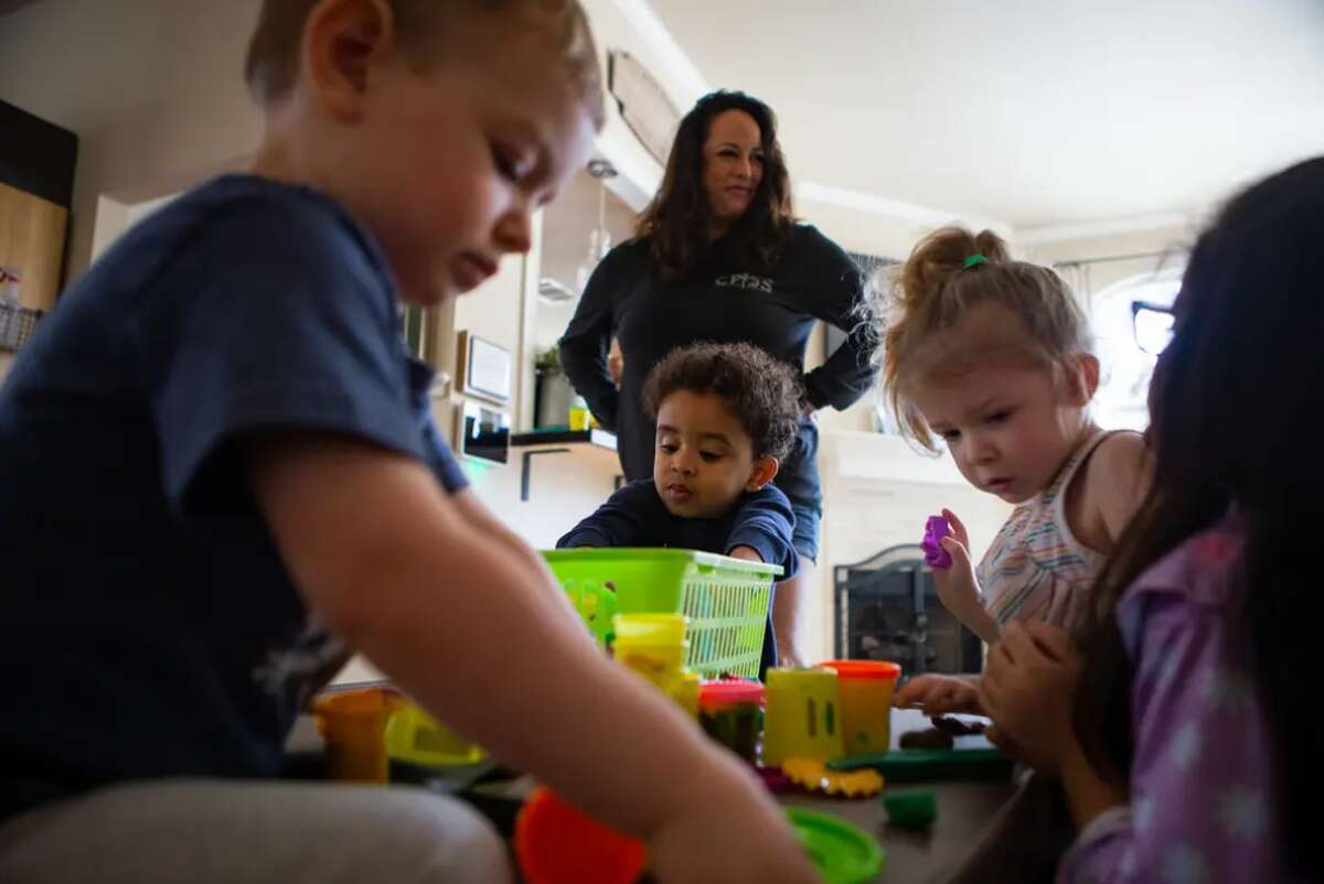 Children play at Kid's Castle Family Daycare and Preschool in Pflugerville on Feb. 28. Phyllis Montoya has operated the day care for 15 years, but since the pandemic began, attendance has mostly been at half capacity.