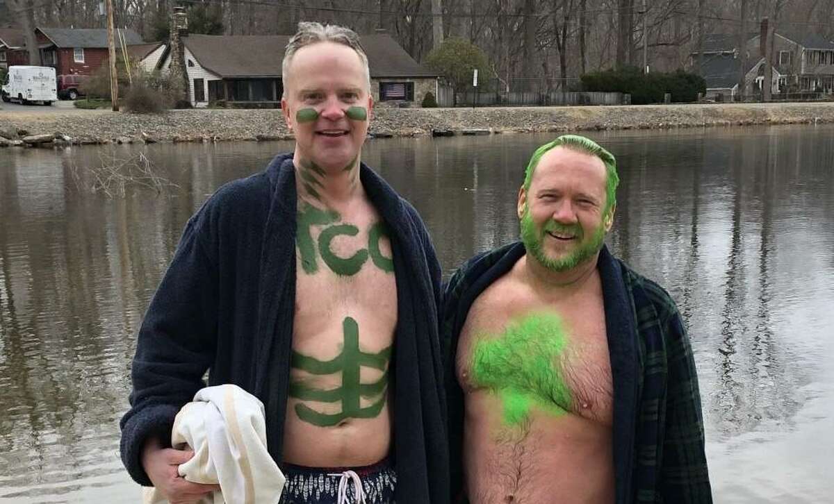Rev. Tim Hare and Rev. Todd Shipley participate in a plunge on March 17, 2021 at Pinewood Lake in Trumbull. Hare and Shipley planned to do another plunge on March 19, 2022. Hare is pastor at the Trumbull Congregational Church and Shipley is pastor at Unity Hill United Church of Christ.
