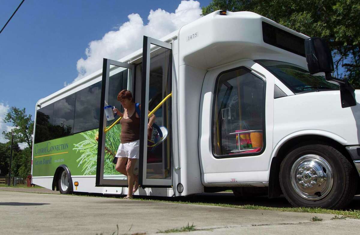 A woman exits a Conroe Connection bus in 2018. The Houston-Galveston Area Council has launched a residential survey of Pearland residents to determine interest in establishing a public transit system in their city.