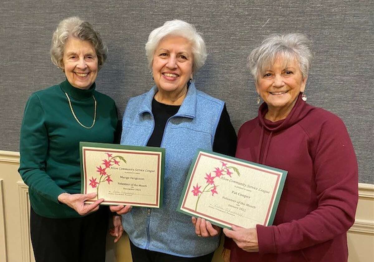The Alton Community Service League recently honored its Volunteers of the Month for November, December and January. Pictured in the middle is Janet Hansen, Placement Chairman, presenting honors to Marge Ferguson, December Volunteer of the Month, and Pat Cooper, January Volunteer of the Month. Not pictured is Diane Foster, Volunteer of the Month in November. 