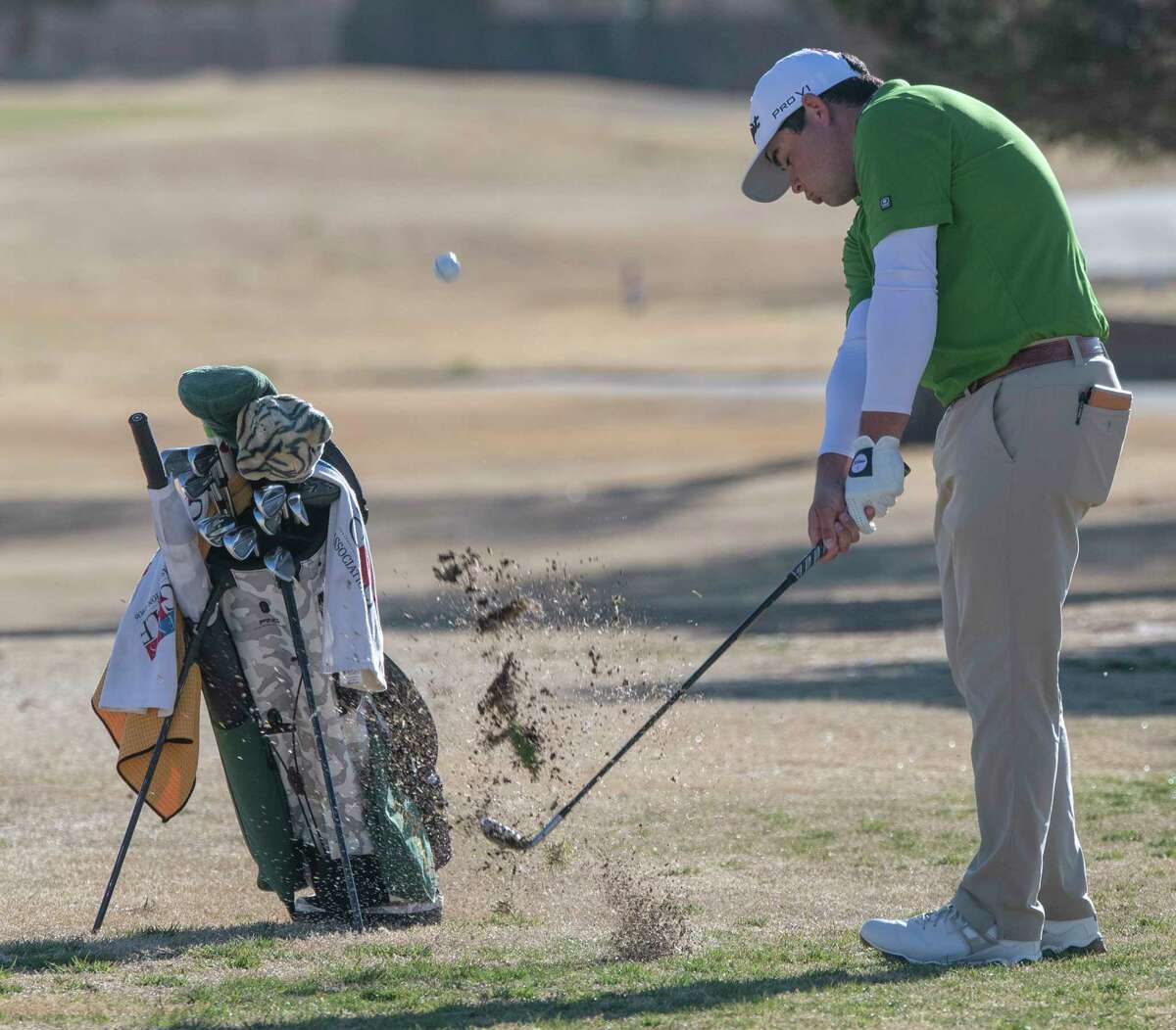 Midland College's JT Pittman chips toward the green 03/15/2022 during the TankLogix Golf Invitational at Ranchland Hills Golf Club. Tim Fischer/Reporter-Telegram