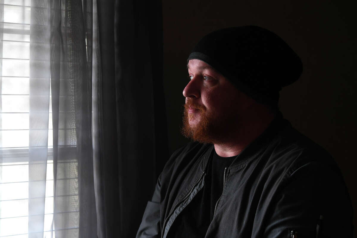 T.J. Rodman looks out from the living room of his home in Lumberton. Rodman is awaiting final word from various aid organizations before heading to Eastern Europe and aid in the humanitarian crisis unfolding as Russia's war in the Ukraine continues. Photo made Friday, March 11, 2022 Kim Brent/The Enterprise