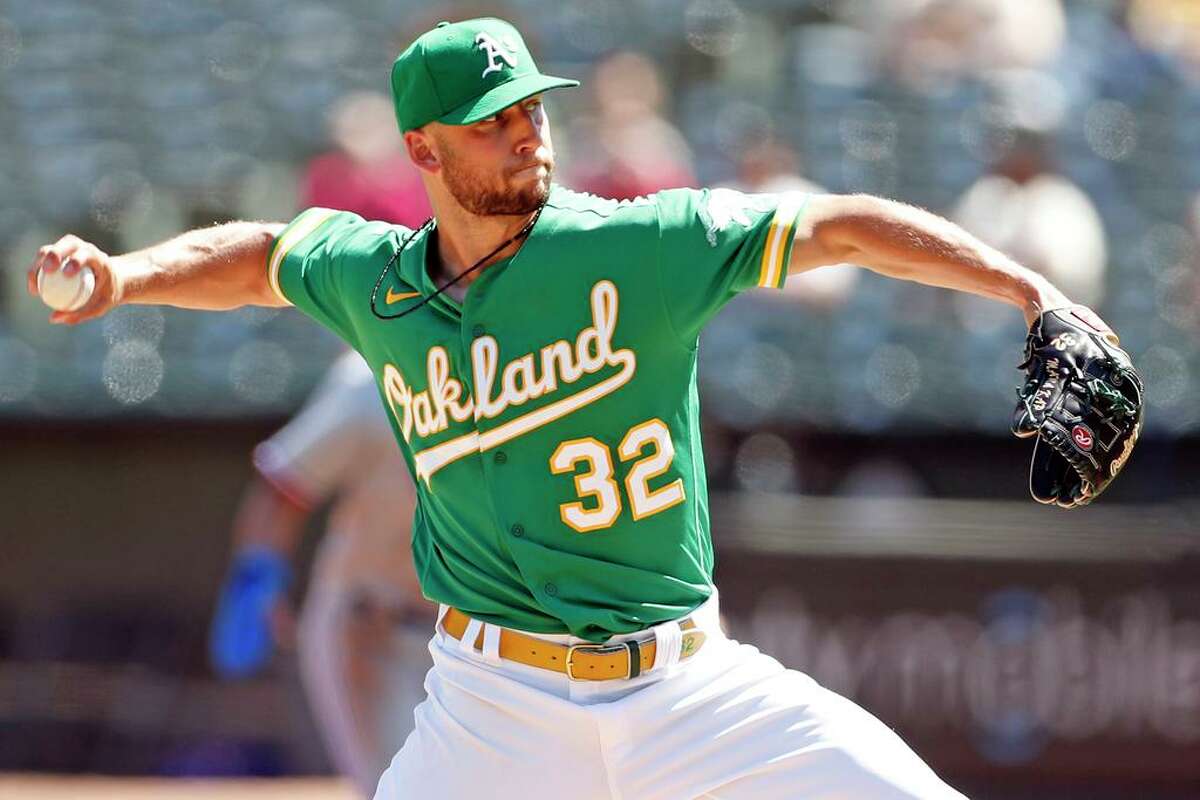 Oakland Athletics' James Kaprielian pitches in 1st inning against Texas Rangers during MLB game at Oakland Coliseum in Oakland, Calif., on Sunday, September 12, 2021.