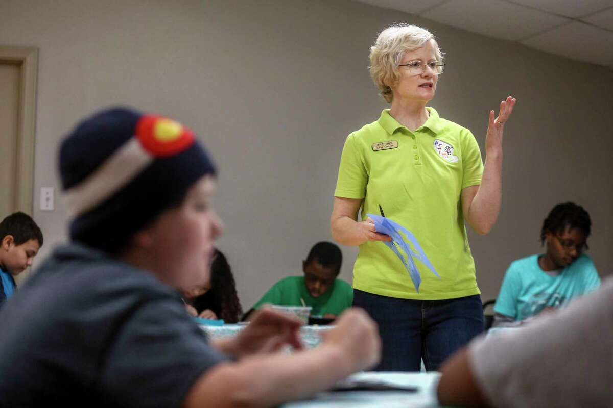 Ukrainian-American art teacher Liliya Colston, 52, of Bulverde, teaches an art class to homeschooled students at Champions Cheerleading in San Antonio on Friday. Colston came to the United States 24 years ago. She is heartsick at the damage and fear sweeping across Ukraine as Russian forces invade and bomb the country her relatives still call home.