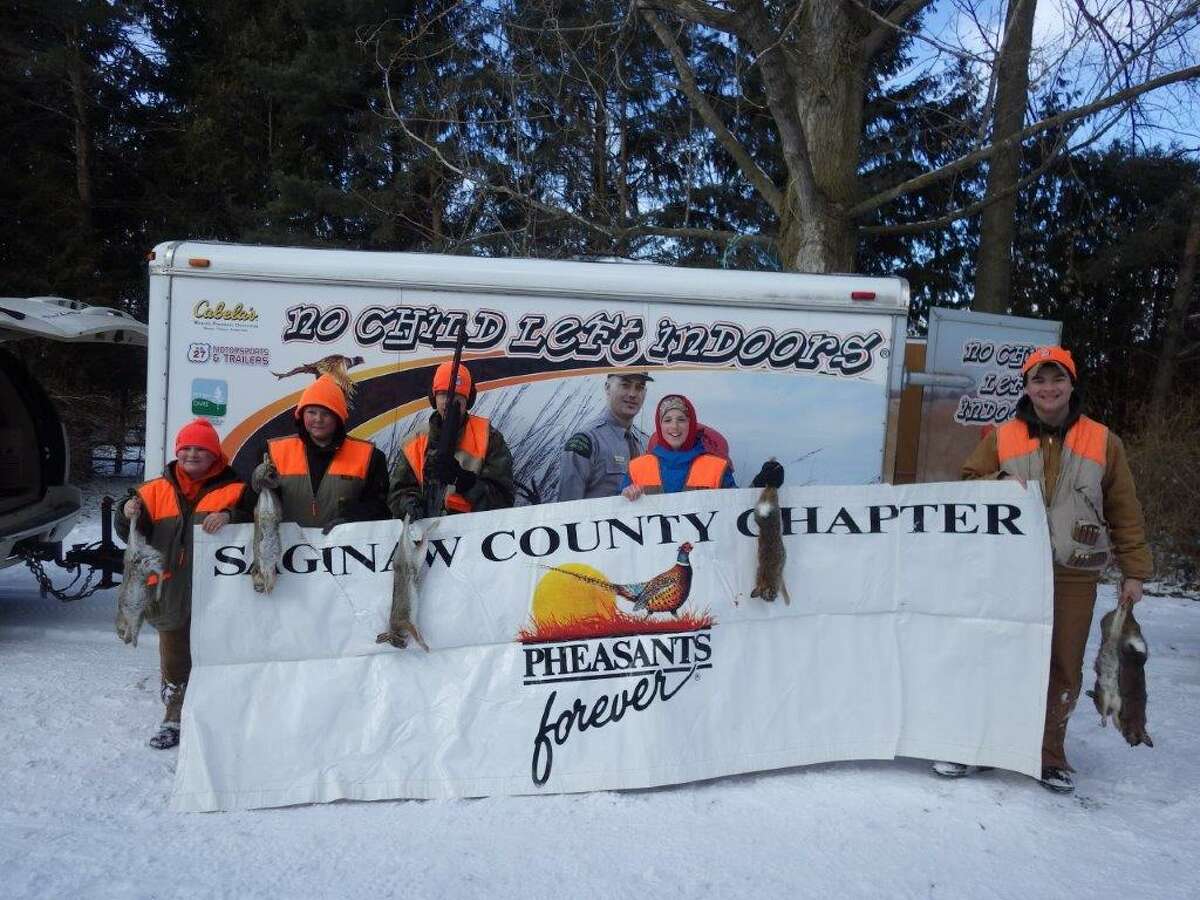  These five boys had a great day last Saturday while rabbit hunting, using beagles, in Tom Lounsbury's "rabbitat." The hunt wassponsored by the Saginaw Chapter of Pheasants Forever.