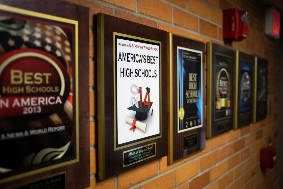 Awards hang on the wall near the main office inside Midland High School Tuesday, March 15, 2022.