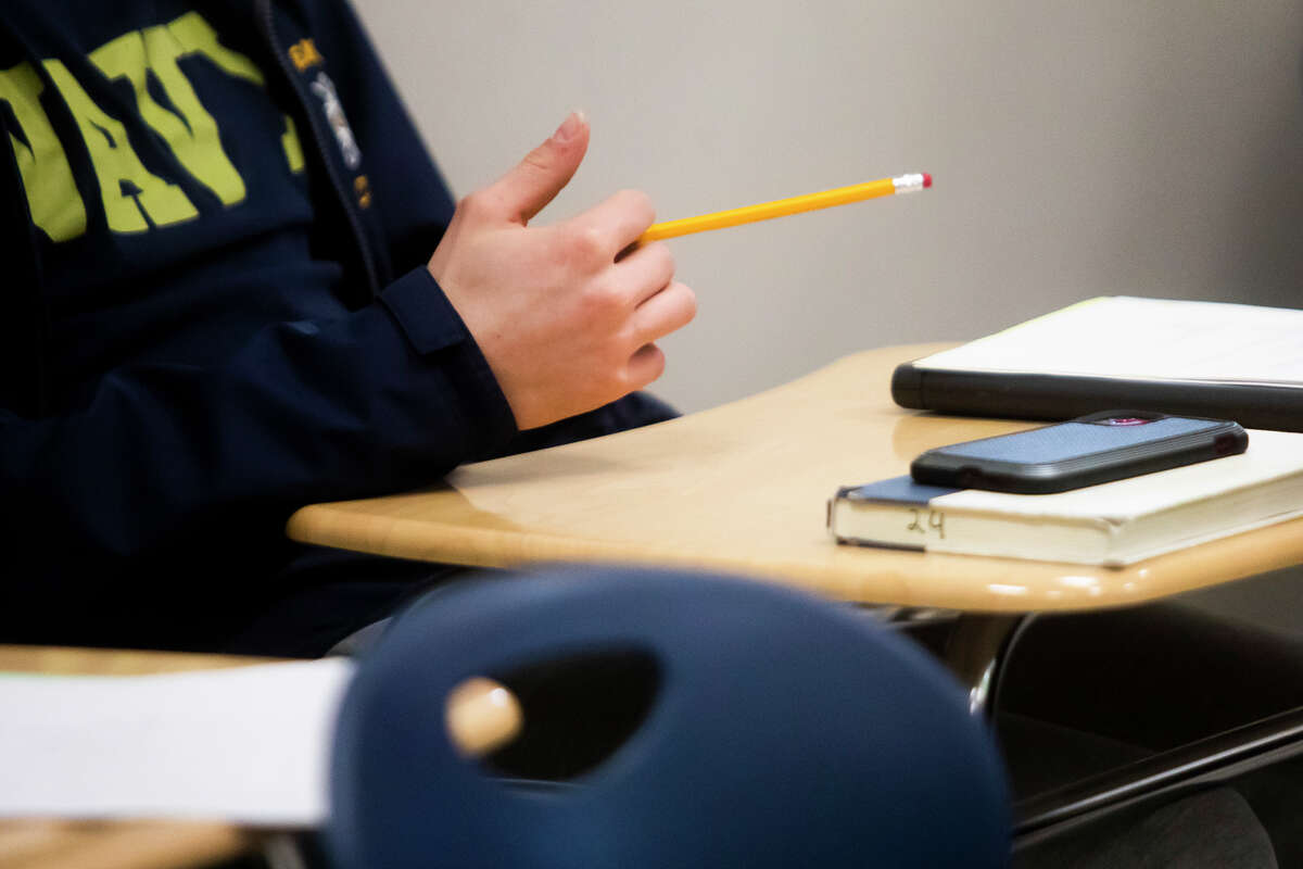 Students listen during the beginning of Mrs. Katy Stearns' sixth period English class Tuesday, March 15, 2022 at Midland High School.