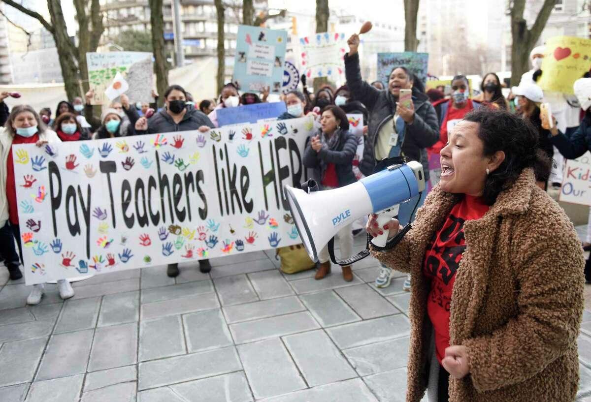 Stamford's Carla Esquivel leads a chant during the Morning Without Childcare rally outside the Government Center in Stamford, Conn. Tuesday, March 15, 2022. More than 100 early childhood educators and members of the United Auto Workers Union gathered outside the Government Center Tuesday morning to push government intervention to give childcare workers a living wage.