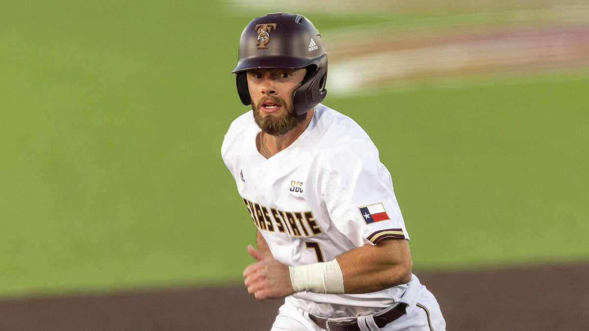 Texas State outfielder John Wuthrich heads for third base against Utah Valley during an NCAA baseball game on Friday, Feb. 18, 2022, in San Marcos, Texas. (AP Photo/Stephen Spillman)