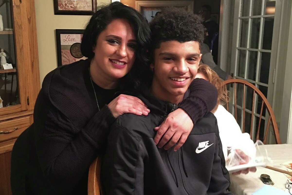 UConn men's basketball sophomore Andre Jackson as a teen with his mother, Tricia Altieri.