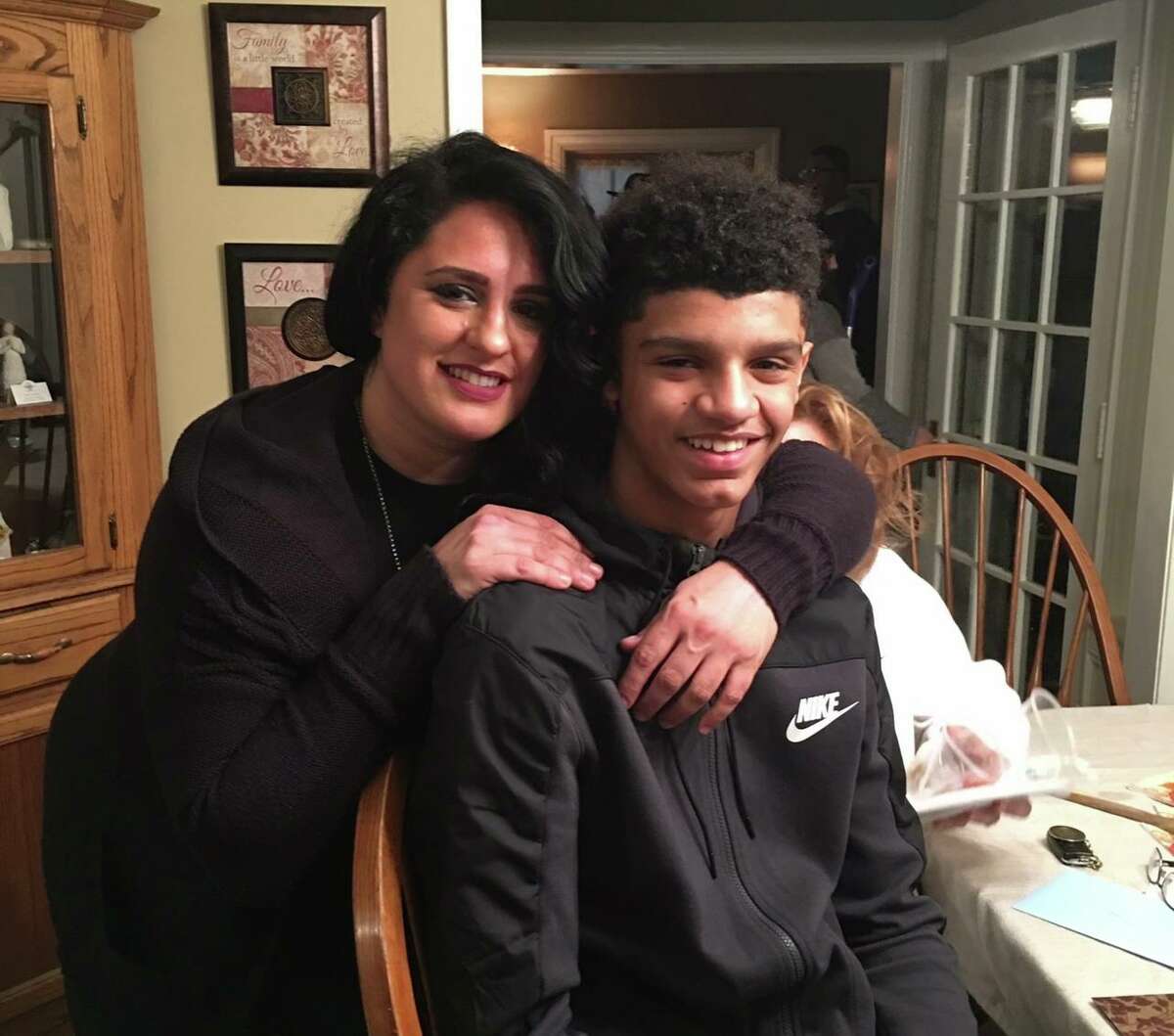 UConn men's basketball sophomore Andre Jackson as a teen with his mother, Tricia Altieri.